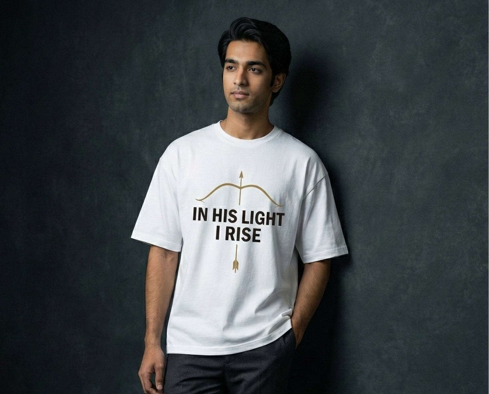 Man wearing a white t-shirt with text against a dark background